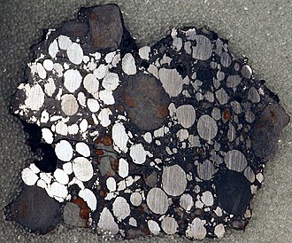 330px-Gujba_meteorite%2C_bencubbinite_%2814785860604%29.jpg